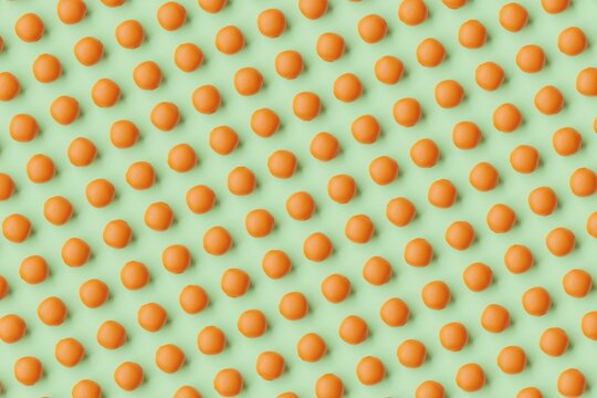 Many oranges on light green background. Top flat view, diagonal grid. 3d render, illustration
