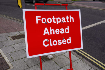 Footpath ahead closed sign on public walkway. maintenance roadworks and pavement repairs 