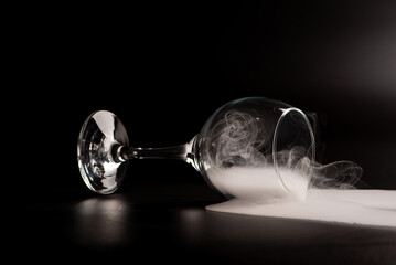 Crystal glass, beautiful Crystal glass with smoke on black background, selective focus.