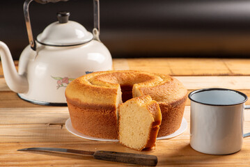 Orange cake, beautiful orange cake and accessories on rustic wood and black background, selective...