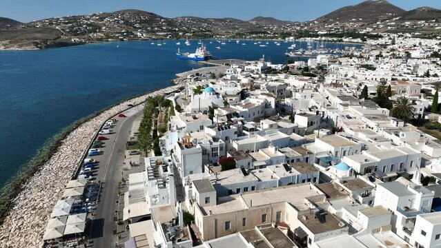 Aerial drone video of traditional settlement of Paroikia with unique Cycladic architecture, Paros island, Cyclades, Greece