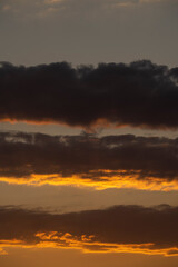 Beautiful sunset in the mountains. Sunset View from the Top of a Mountain. Sunset in strong orange tones in Serbia. The sun falls for horizon, a sunset. Shadows are condensed, beautiful clouds.
