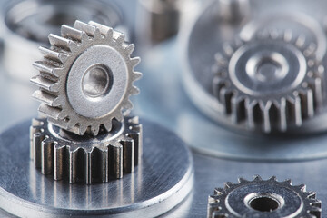 metal gears and bearings. Background with part of the mechanism.