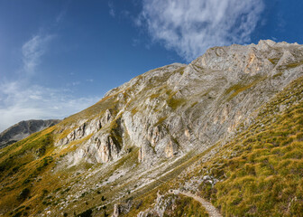 Trekking route from Vihren hut to Kazana shelter on the Mt. Vihren slope. Pirin highlands in summer sunny day. Bansko, Bulgaria.