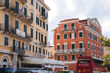 Naklejka premium Corfu street view, Kerkyra old town beautiful cityscape, Ionian sea Islands, Greece, a summer sunny day, pedestrian streets with shops and cafes, architecture of historic center, travel to Greece