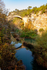 Fototapeta na wymiar Turkey's waterfalls and rivers. Historic stone bridge and waterfall. Clandras bridge and Clandras waterfall. Usak , Turkey