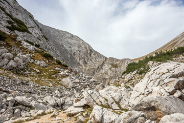 Landscape between Vihren and Kutelo peaks near Kazana shelter in summer day. Pirin national park, Bulgaria.