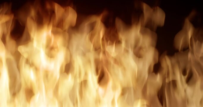 4K slow-motion closeup fire VFX insert element. It has a slow-motion inferno firewall looped, and the fire is quickly captured. It is ideal for visual effects and motion graphics.	