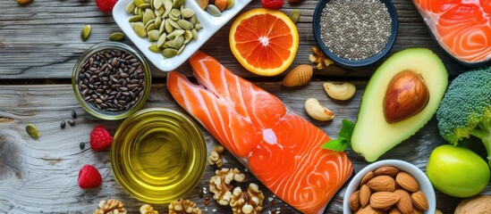 Bird's-eye image of nutritious omega-3 foods: Diverse options include fish, nuts, seeds, fruit, veggies, and oil. - obrazy, fototapety, plakaty