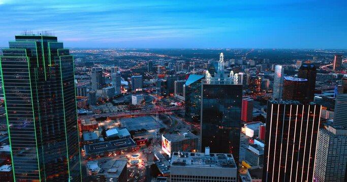Breath-taking view of Dallas, Texas, USA at dusk. Amazing city scenery of switching on illumination from top.