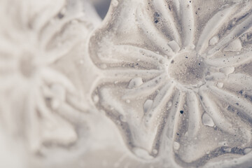 detail of a flower pattern in a clay pot