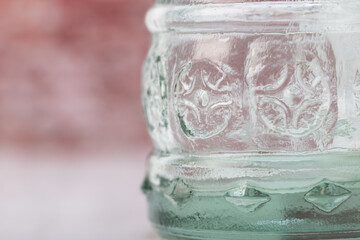 close up detail of pattern glass bottle with copy space