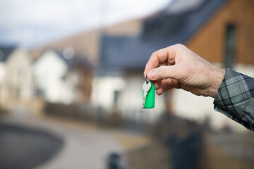 man buying new house holding key
