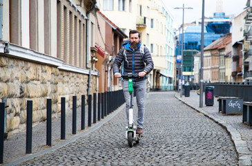 man riding electric roller in the city