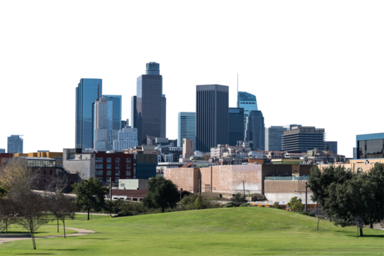 Downtown Los Angeles skyline with grassy park in foreground isolated with cut out background.