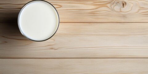 Fototapeta na wymiar Overhead view of milk on table with space.
