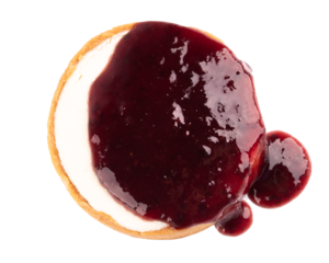 cheese cake with pouring dripping berry jam isolated on white background top view