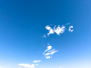 Bright blue sky with clouds - 728871834