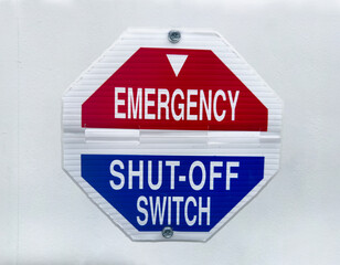 Emergency shut off switch sign on a wall - 728871849