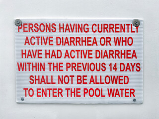 Diarrhea warning sign on a pool side