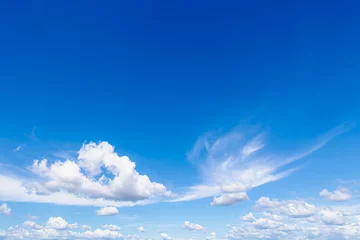 Deurstickers Beautiful white puffy cloud in strange shaped floating in blue sky, Cirrus clouds are short, detached, hair-like clouds found at high altitudes, Horizon nature background with free copy space. © Sarawut