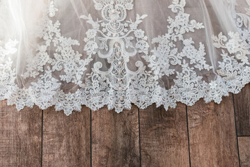 white lace on wooden background