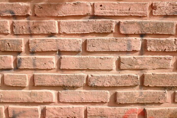 The walls of the building are made of very sturdy red bricks.
