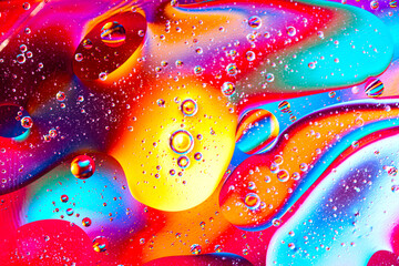 movement of oil bubbles in the liquid. Fantastic structure of colorful bubbles. Colorful artistic...