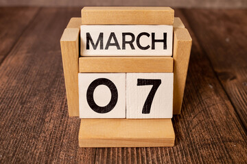 Day 7 of March month, Wooden calendar with date. Empty space for text.