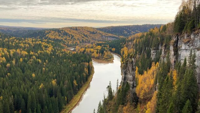 View of the Usva pillars and the river in autumn. Amazing view of the picturesque Usva River flowing through the rocky terrain in the Perm region, unique relief forms, stone pillars. Russia 4K