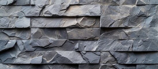 Modern style design with decorative uneven cracked real stone wall surface in gray color pattern...