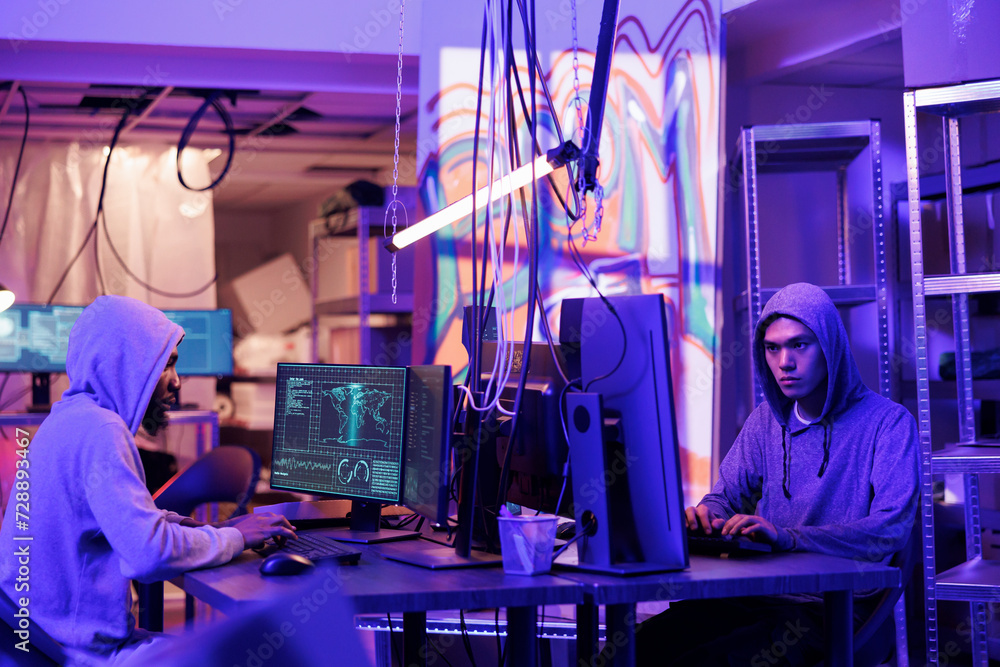 Poster hackers collaborating while coding virus software, doing illegal activities and breaking law in aban