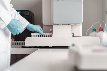 Close up of male scientist in uniform working in medical research laboratory use special equipment