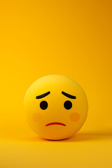 Fototapeta premium Sad emoji on a yellow background