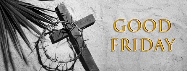 Crown of thorns, wooden cross and palm leaf on sand. Good Friday