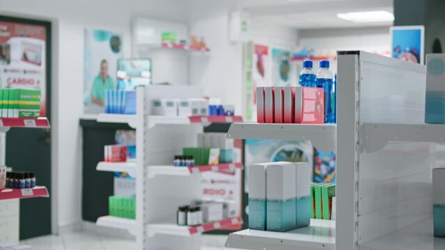 Empty drugstore with pharmaceuticals and nutritional products, pharmacy racks filled with prescription antibiotics, remedies for pain and medical supplies. Wellness store sells pills in boxes.