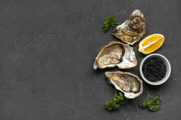 Tasty oysters with lemon and caviar on black background