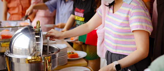 People hand grab buffet asian food in hotel seminar room