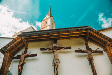 Jesus Christ and martyrs crucifixion on wooden crosses in the Church of St. Leonard.Church of St....