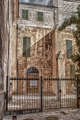The stone facade in the style of the Majorcan palaces.
