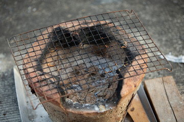 Brazier with charcoal in the kitchen. Close-up.