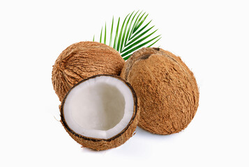 Coconut with half and green leaves on white background