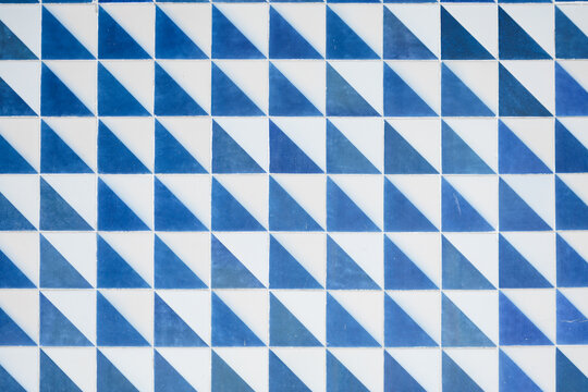 Ocean inspired tile mosaic in white and blue with geometric shapes. 