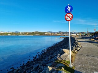 Crooked sign down by the seaside