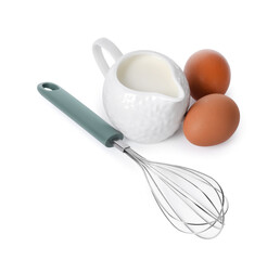Whisk, raw eggs and jug of milk isolated on white, above view