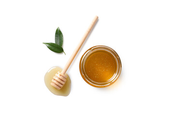 Tasty honey in glass jar, leaves and dipper on white background, flat lay