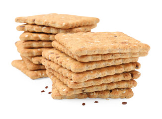 Stacks of cereal crackers with flax and sesame seeds isolated on white