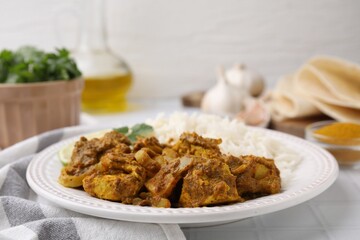 Delicious chicken curry with rice on table, closeup