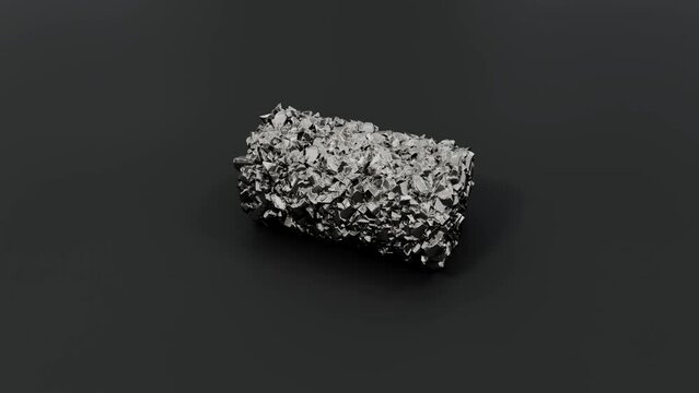 Rough, metallic textured titanium mineral on a dark surface.