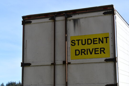 Student Driver sign posted on back of Tractor Trailer.